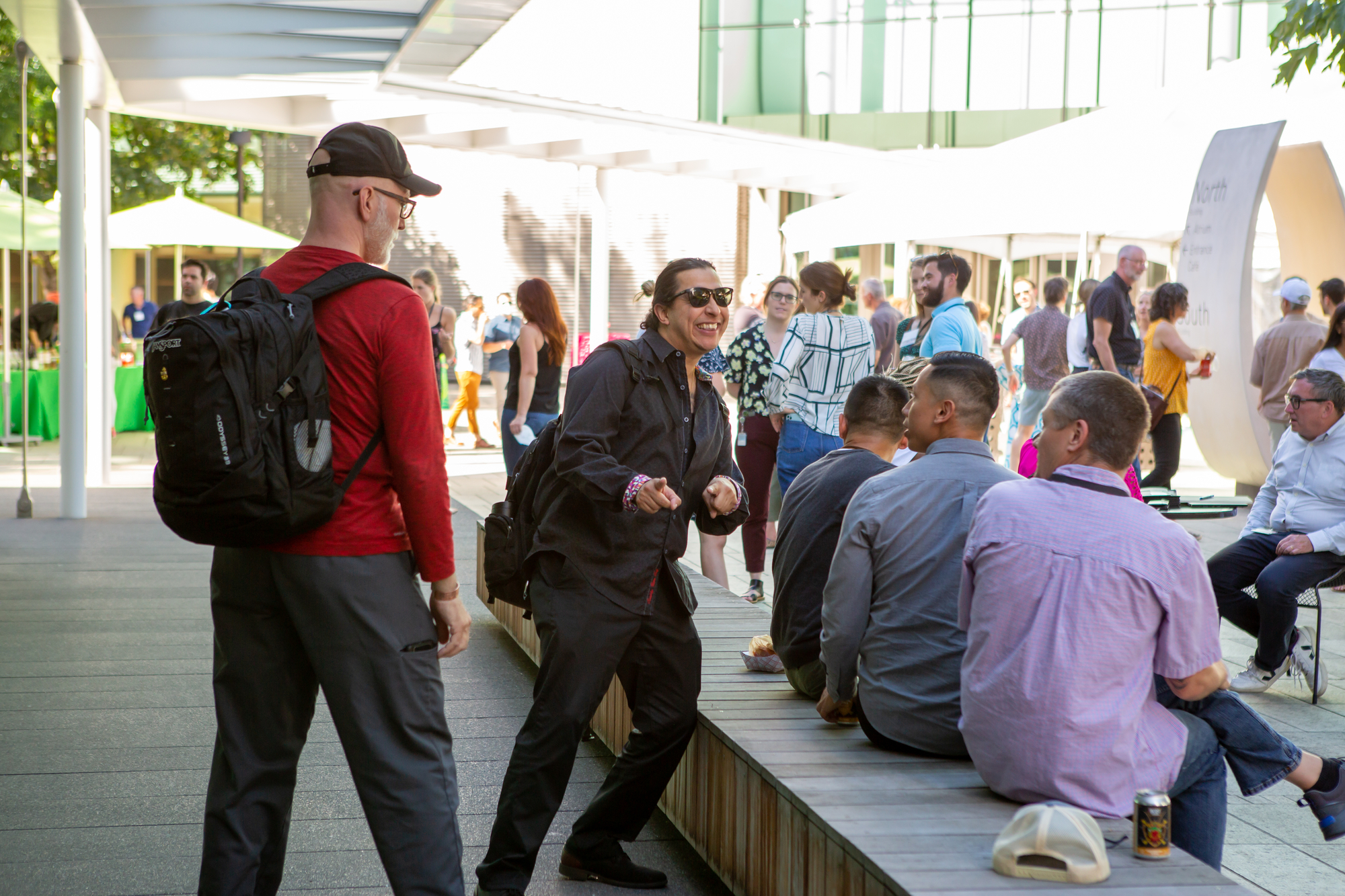 People gathering in an outdoor courtyard