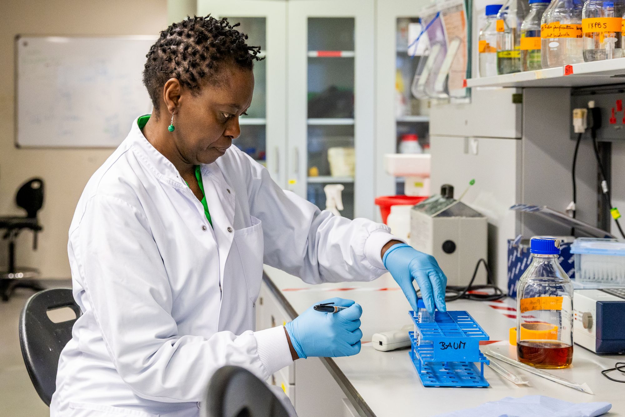 Dr. Faith Osier works in the laboratory of the Sir Alexander Fleming Building at Imperial College London in London, UK.