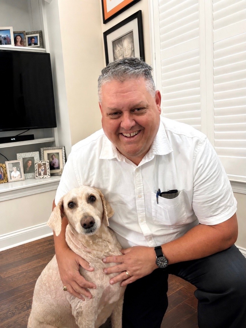 James Austin with his 11-year-old golden doodle, Oliver.