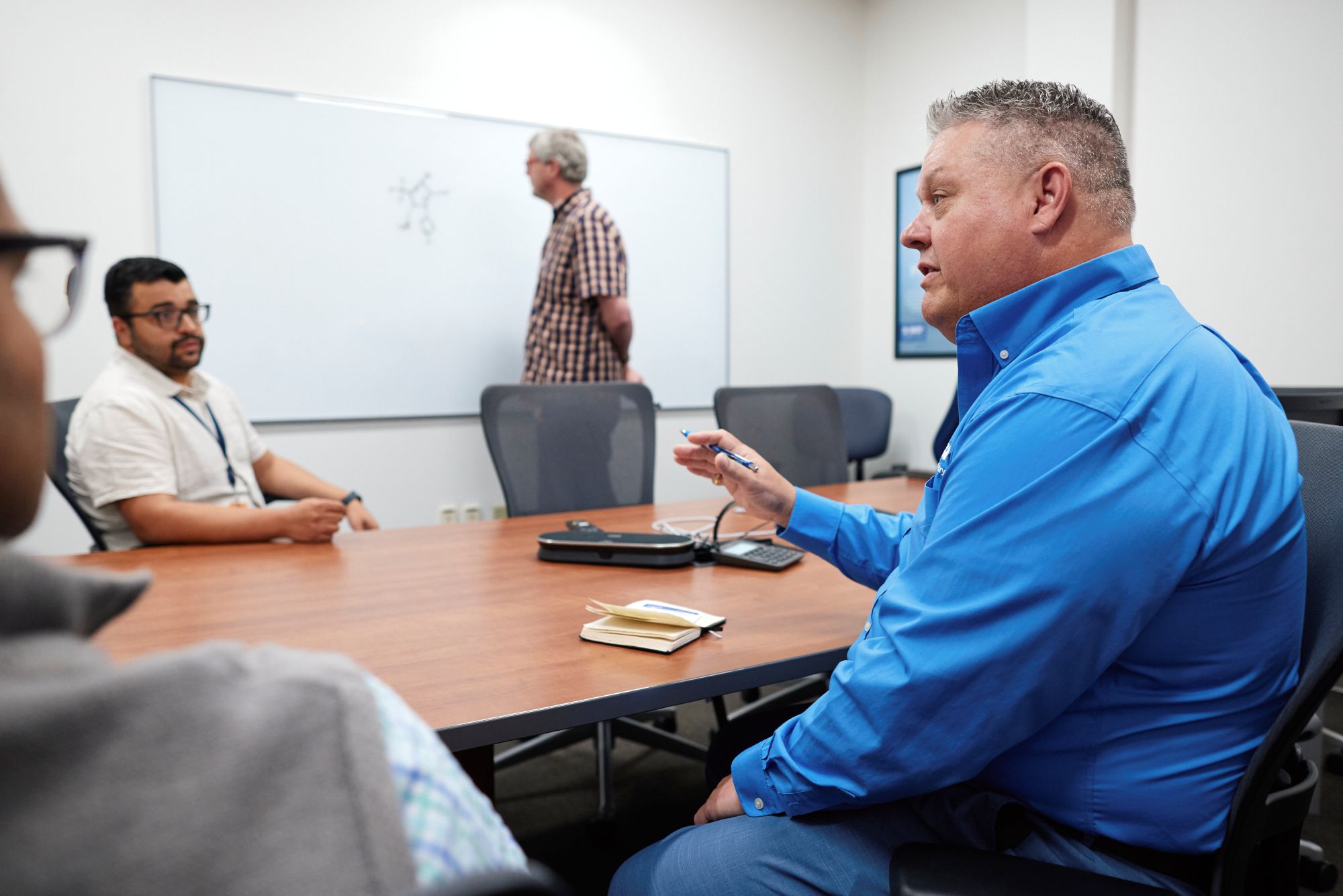 James Austin meeting with colleagues in a conference room on the BASF campus in Durham, NC.
