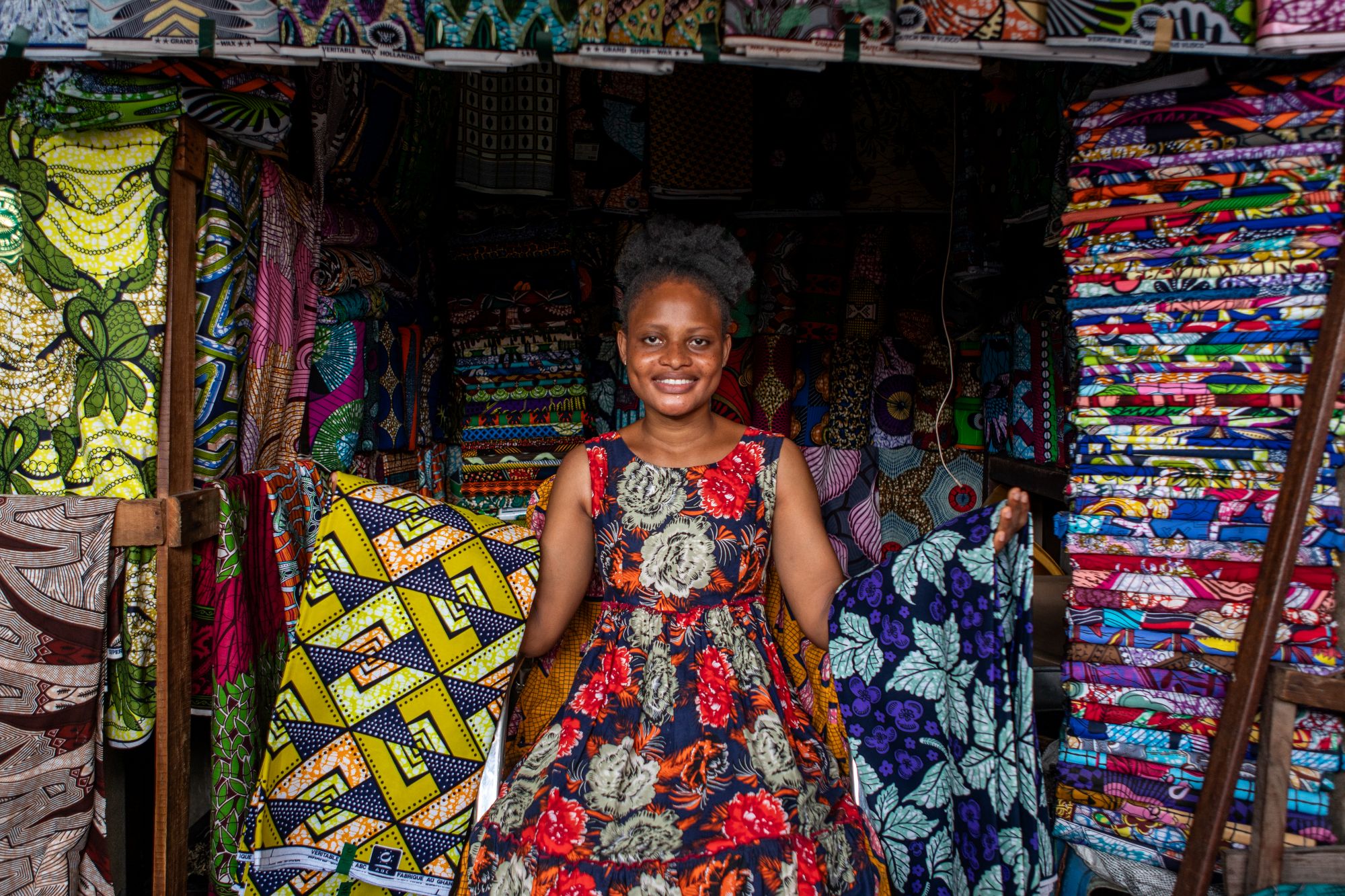 Portrait of a fabric seller at the Dantokpa market in Cotonou, Benin.