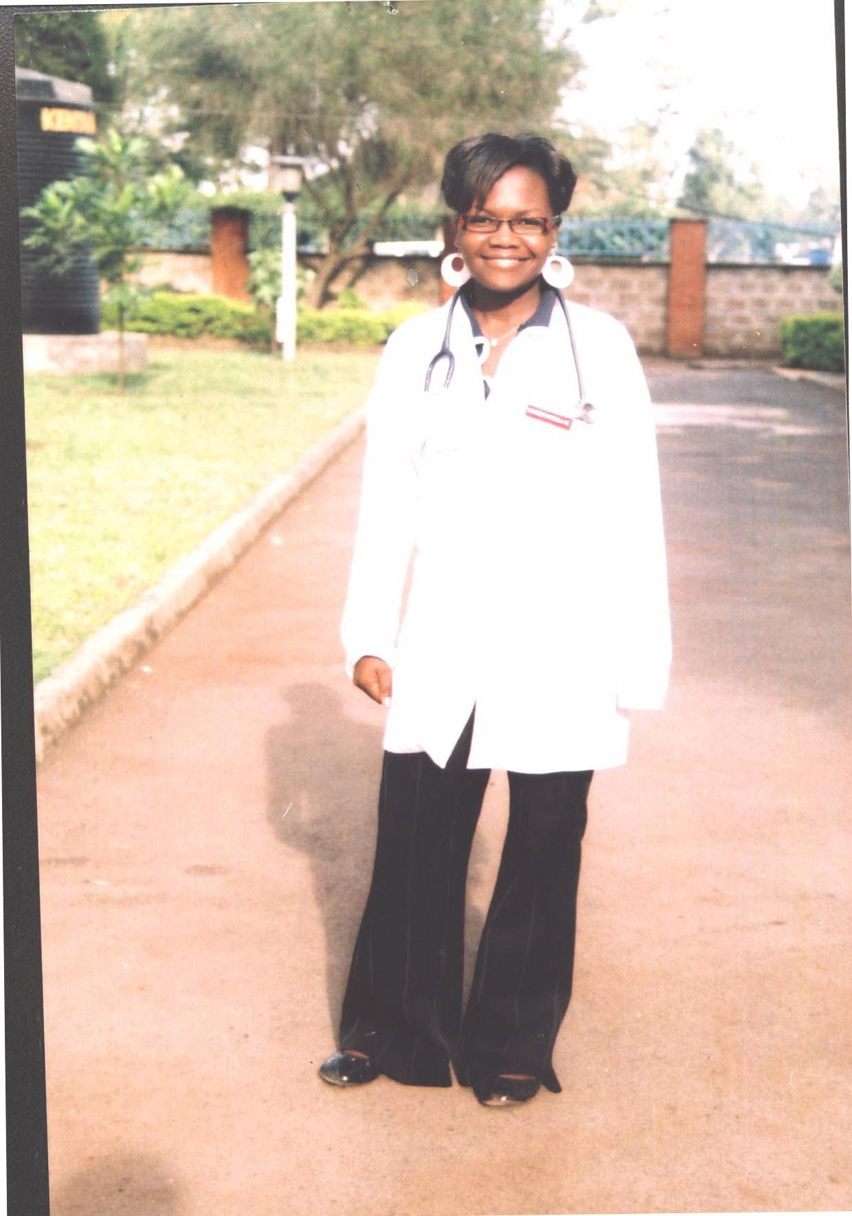Dr. Stellah Bosire in a white coat with a stethoscope