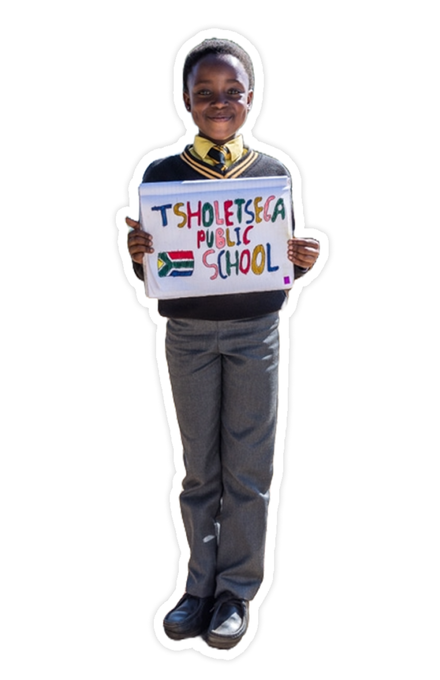 A student holds a sign at Tsholetsega Public School.