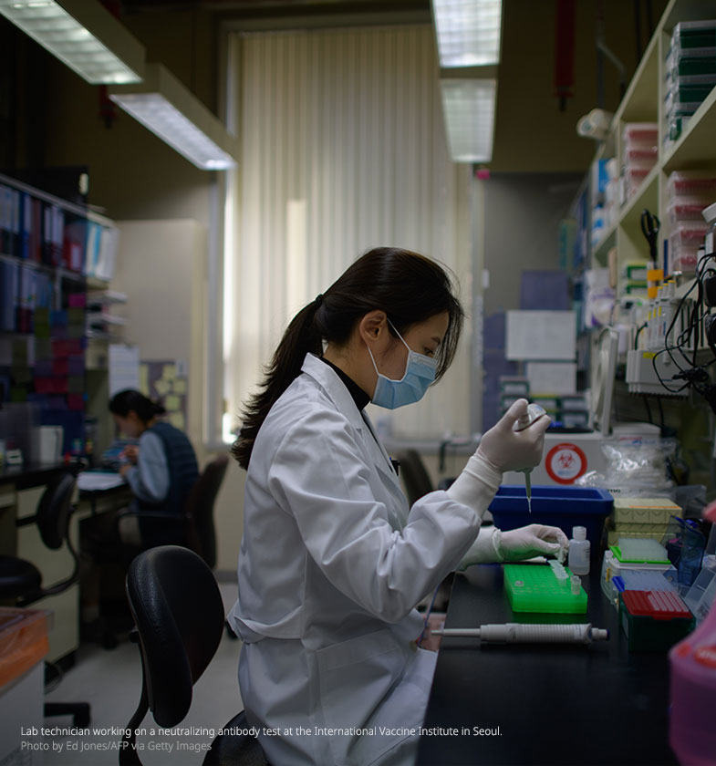 Lab technician working on a neutralizing antibody test at a Bio Safety Level 3 laboratory at the International Vaccine Institute in Seoul.