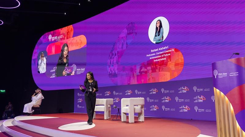 A speaker on stage at a Misk Foundation event