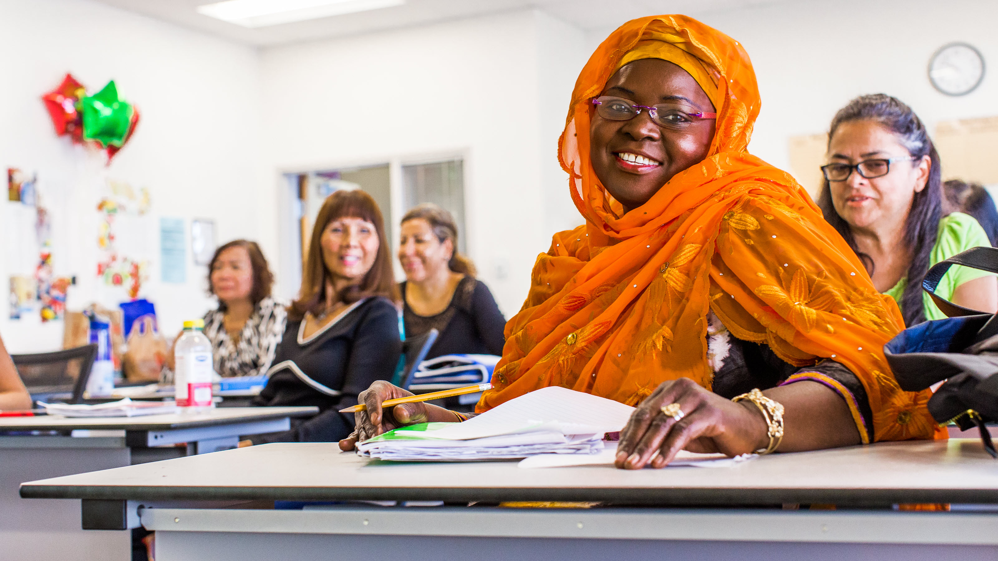 Learners and facilitators in a classroom setting in North America.